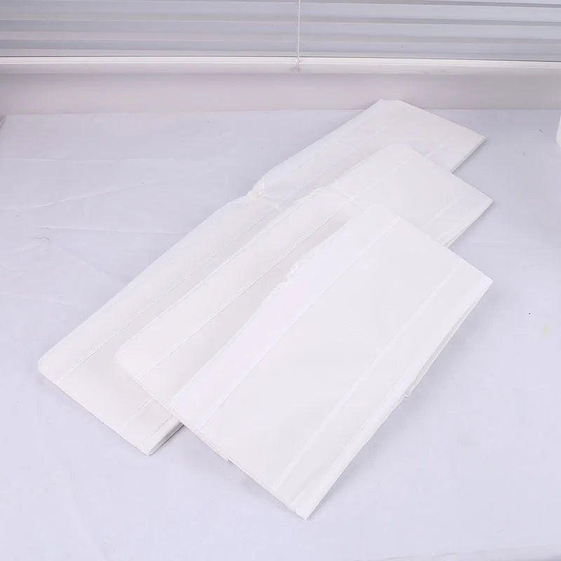 Three large, white OWOW Me foldable clothes organizers with compartment storage boxes are arranged on a white surface with a light background and window blinds, showcasing their sleek design for organizing clothing.