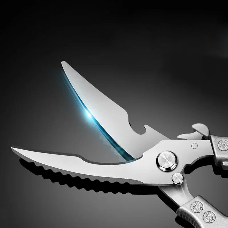 Close-up of OWOW Me Stainless Steel Poultry Bone Cutter Scissors, partially open to reveal serrated and straight edges on a dark reflective surface, with blue light highlighting these sharp, versatile kitchen shears.