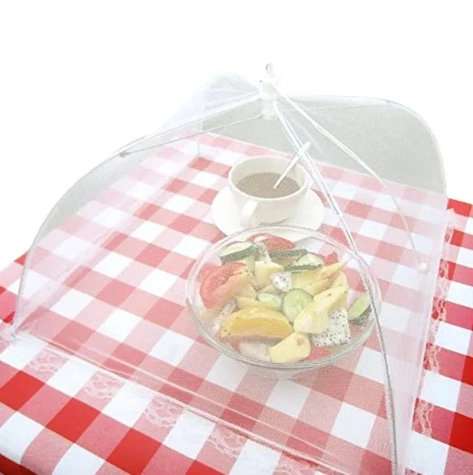 The OWOW Me Best foldable anti-fly screen mesh for food white keeps your snacks fresh by protecting mixed fruit salad and coffee on a red and white checkered tablecloth while being eco-friendly.