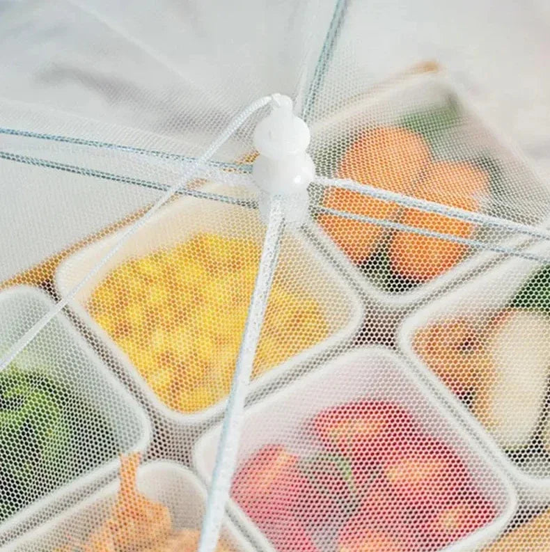 The OWOW Me Best foldable anti-fly screen mesh for food in white covers several small bowls of corn, strawberries, and leafy greens, keeping your dishes protected in an eco-friendly way.