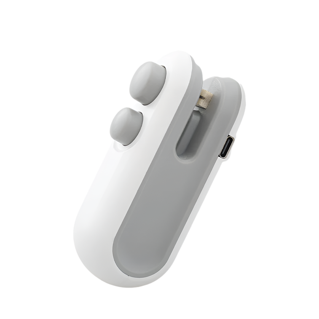 The OWOW Me Mini heat sealer magnet clip for snack bags in white is a compact device with two round buttons and a charging slot, designed to keep snacks fresh thanks to its rechargeable sealing function.